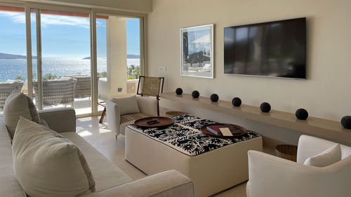 Each villa has a beautiful living space and floor-to-ceiling windows.