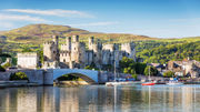 Conwy Castle, with Snowdonia National Park in the background. English King Edward I built the fortress in the 13th century.